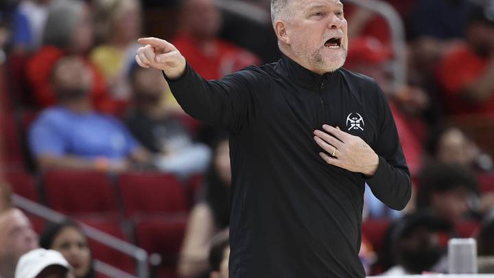 Mar 23, 2025; Houston, Texas, USA; Denver Nuggets head coach Michael Malone reacts during the third quarter against the Houston Rockets at Toyota Center. Mandatory Credit: Troy Taormina-Imagn Images