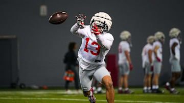 Ohio State Buckeyes cornerback Miles Lockhart (13) catches a pass during spring football practice at the Woody Hayes Athletic Center on Wednesday, March 19, 2025 in Columbus, Ohio.