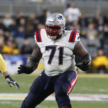 Dec 7, 2023; Pittsburgh, Pennsylvania, USA;  New England Patriots guard Mike Onwenu (71) blocks against Pittsburgh Steelers linebacker T.J. Watt (90) during the second quarter at Acrisure Stadium. Mandatory Credit: Charles LeClaire-USA TODAY Sports