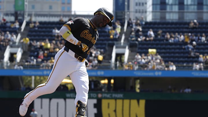 Pittsburgh Pirates designated hitter Andrew McCutchen (22) circles the bases on a solo home run against the Washington Nationals during the third inning at PNC Park. 