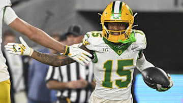 Sep 28, 2024; Pasadena, California, USA; Oregon Ducks wide receiver Tez Johnson (15) celebrates scoring a touchdown the fourth quarter against the UCLA Bruins at Rose Bowl. Mandatory Credit: Robert Hanashiro-Imagn Images