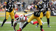 Pittsburgh Steelers WR George Pickens runs after a catch past Kansas City Chiefs cornerback Joshua Williams.
