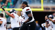 Northern Illinois offensive lineman Abiathar Curry jumps in the air in celebration after winning a NCAA college football game 16-14 against Notre Dame at Notre Dame Stadium on Saturday, Sept. 7, 2024, in South Bend.