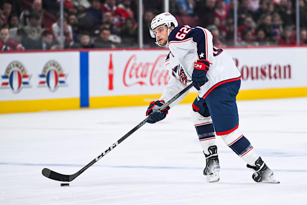 Hockey player shoots puck