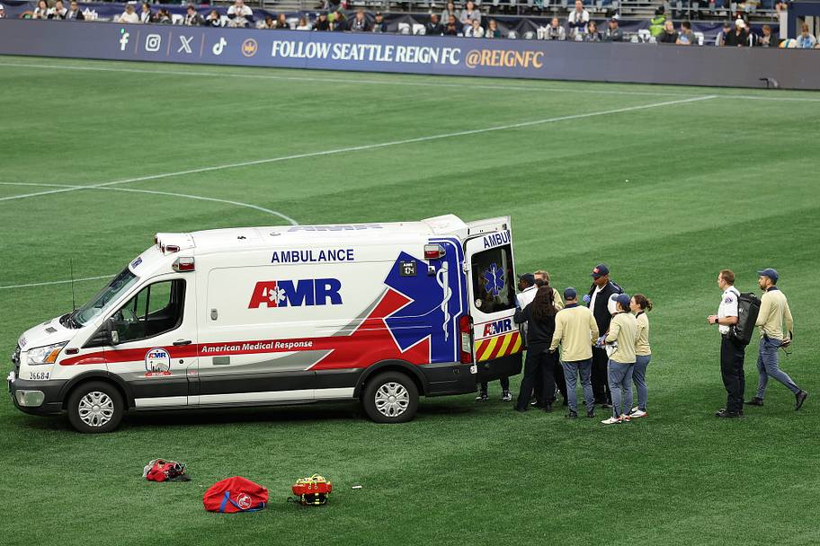 Savannah DeMelo leaves the field in an ambulance