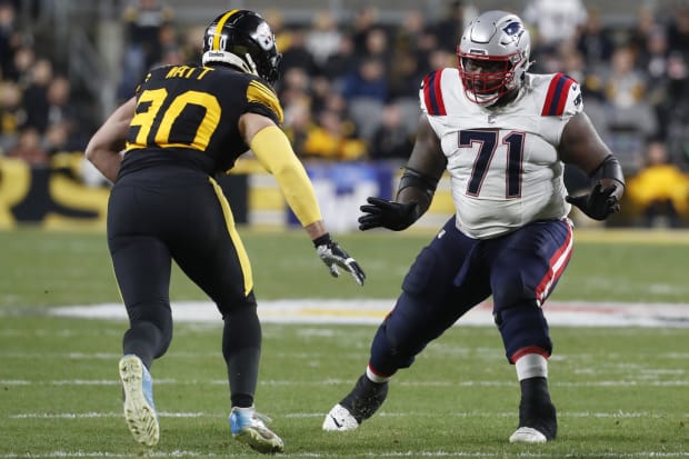 Dec 7, 2023; Pittsburgh, Pennsylvania, USA;  New England Patriots guard Mike Onwenu (71) blocks against Pittsburgh Steelers linebacker T.J. Watt (90) during the second quarter at Acrisure Stadium. Mandatory Credit: Charles LeClaire-USA TODAY Sports