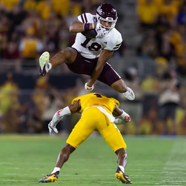 Mississippi State Bulldogs tight end Seydou Traore leaps and hurdles over Arizona State Sun Devils defensive back Keith Abney