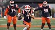 Nov 15, 2025; Champaign, Illinois, USA; Illinois Fighting Illini quarterback Luke Altmyer (9) runs the ball during the first half against the Maryland Terrapins at Memorial Stadium. Mandatory Credit: Ron Johnson-Imagn Images