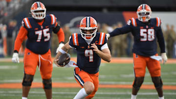 Nov 15, 2025; Champaign, Illinois, USA; Illinois Fighting Illini quarterback Luke Altmyer (9) runs the ball during the first half against the Maryland Terrapins at Memorial Stadium. Mandatory Credit: Ron Johnson-Imagn Images