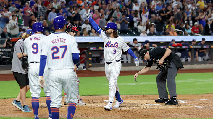 Sep 4, 2024; New York City, New York, USA; New York Mets designated hitter Jesse Winker (3) celebrates his grand slam home run against the Boston Red Sox with left fielder Brandon Nimmo (9) and third baseman Mark Vientos (27) during the first inning at Citi Field. Mandatory Credit: Brad Penner-Imagn Images