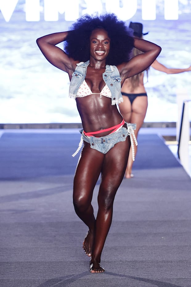 Tunde Oyeneyin walks the runway for the Sports Illustrated Swimsuit Runway Show