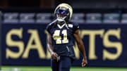 Aug 11, 2023; Metairie, LA, USA;  New Orleans Saints running back Alvin Kamara (41) looks on during training camp at the Caesars Superdome. Mandatory Credit: Stephen Lew-USA TODAY Sports