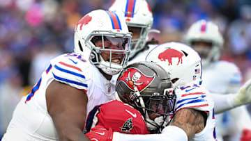 Nov 16, 2025; Orchard Park, New York, USA; Buffalo Bills defensive tackle Deone Walker (96) and safety Jordan Poyer (21) tackle Tampa Bay Buccaneers running back Sean Tucker (44)