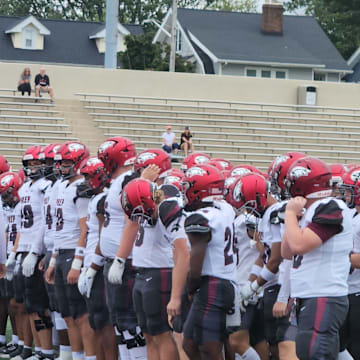 St. Joseph's Prep players gather together before running drills prior to a game against Lakewood St. Edward (Ohio) on August 31, 2024. 