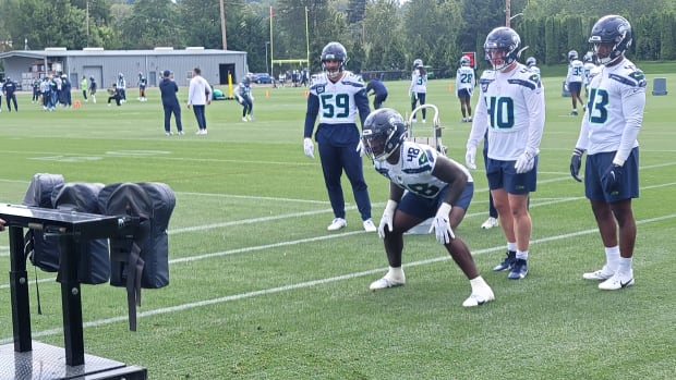 Seahawks rookie linebacker Tyrice Knight prepares for a sled shed drill during Wednesday's OTA practice.