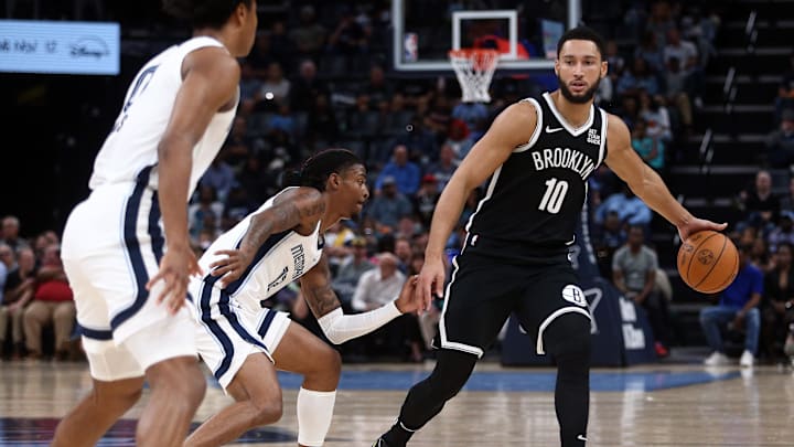 Oct 30, 2024; Memphis, Tennessee, USA; Brooklyn Nets guard Ben Simmons (10) dribbles as Memphis Grizzlies guard Ja Morant (12) defends during the first half at FedExForum. Mandatory Credit: Petre Thomas-Imagn Images