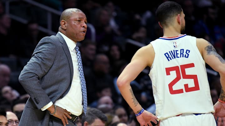 LA Clippers head coach Doc Rivers (left) talks with guard Austin Rivers (right) against Phoenix Suns during a game at Staples Center. 