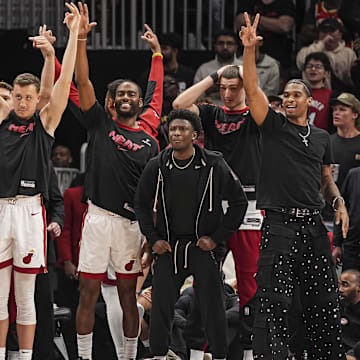 Apr 18, 2025; Atlanta, Georgia, USA; The Miami Heat bench react against the Atlanta Hawks during overtime at State Farm Arena. Mandatory Credit: Dale Zanine-Imagn Images