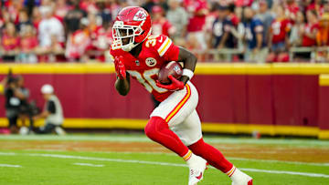 Aug 22, 2025; Kansas City, Missouri, USA; Kansas City Chiefs running back Brashard Smith (30) returns a kickoff during the first half against the Chicago Bears at GEHA Field at Arrowhead Stadium.