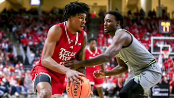 Feb 4, 2025; Lubbock, Texas, USA;  Texas Tech Red Raiders forward JT Toppin (15) dribbles the ball against Baylor Bears guard Jayden Nunn (2) in the first half at United Supermarkets Arena. Mandatory Credit: Michael C. Johnson-Imagn Images
