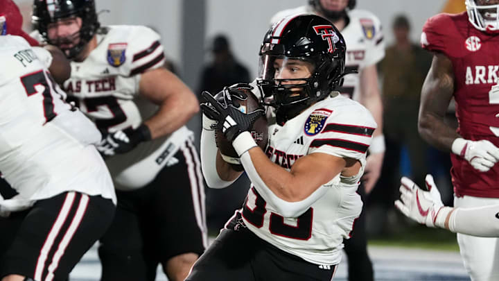 Texas Tech's Cameron Dickey (33) runs with the ball during the AutoZone Liberty Bowl between Arkansas and Texas Tech in Memphis, Tenn., on Friday, December 27, 2024.