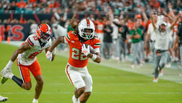 Nov 8, 2025; Miami Gardens, Florida, USA; Miami Hurricanes running back Girard Pringle Jr. (22) rushes for a touchdown against the Syracuse Orange during the third quarter at Hard Rock Stadium. Mandatory Credit: Jeff Romance-Imagn Images