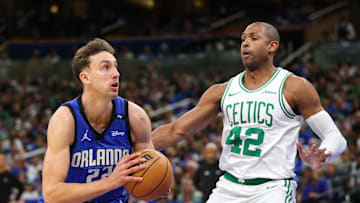 Apr 27, 2025; Orlando, Florida, USA; Orlando Magic forward Franz Wagner (22) drives to the basket past Boston Celtics center Al Horford (42) in the first quarter during game four of first round for the 2025 NBA Playoffs at Kia Center. Mandatory Credit: Nathan Ray Seebeck-Imagn Images