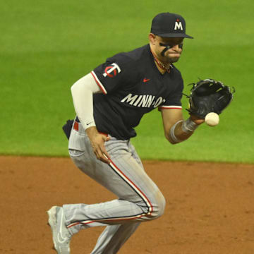 Sep 17, 2024; Cleveland, Ohio, USA; Minnesota Twins third baseman Royce Lewis (23) fields a ground ball in the fifth inning against the Cleveland Guardians at Progressive Field. Mandatory Credit: David Richard-Imagn Images