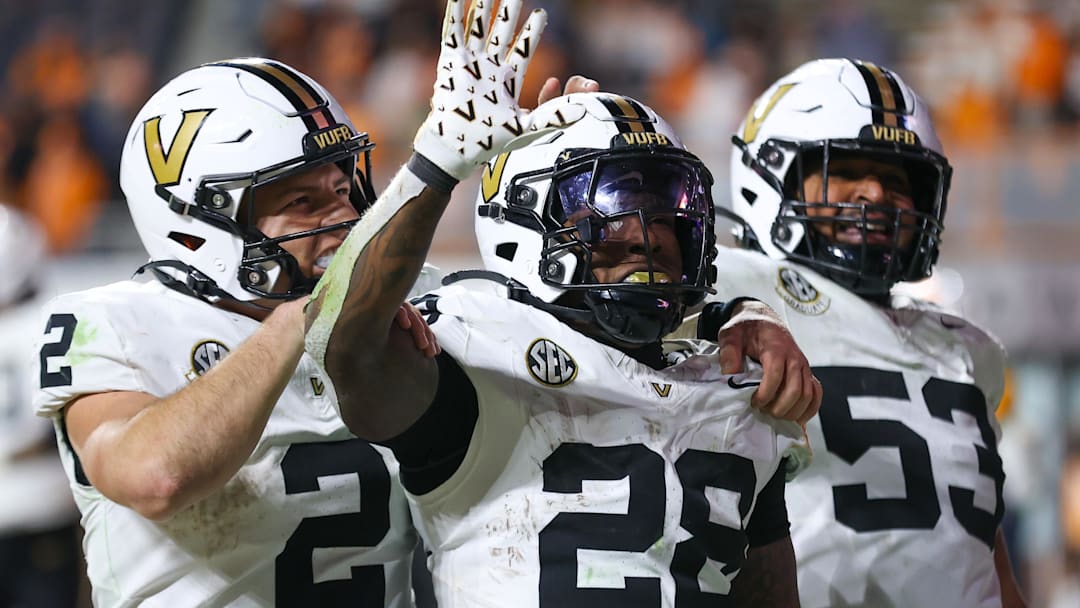 Nov 29, 2025; Knoxville, Tennessee, USA;  Vanderbilt Commodores quarterback Diego Pavia (2), running back Sedrick Alexander (28) and offensive lineman Jordan White (53) celebrate a touchdown against the Tennessee Volunteers during the second half at Neyland Stadium. Mandatory Credit: Randy Sartin-Imagn Images