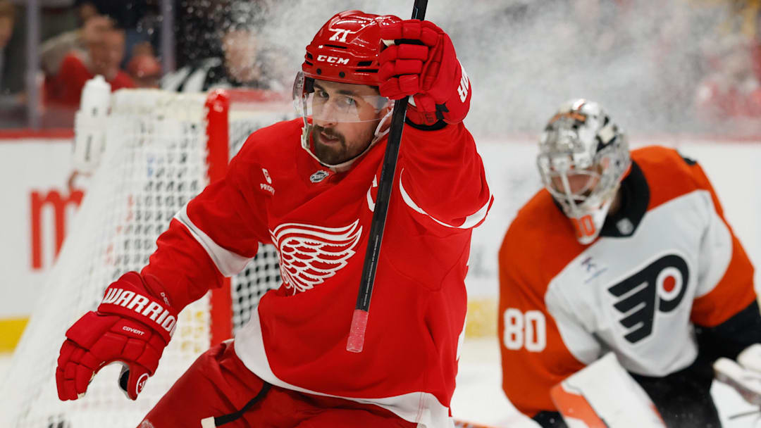 Mar 28, 2026; Detroit, Michigan, USA;  Detroit Red Wings center Dylan Larkin (71) celebrates after scoring on Philadelphia Flyers goaltender Dan Vladar (80) in the second period at Little Caesars Arena. Mandatory Credit: Rick Osentoski-Imagn Images