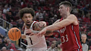 Nov 26, 2025; Louisville, Kentucky, USA;  Louisville Cardinals guard J'Vonne Hadley (1) drives to the basket against NJIT Highlanders forward Zack Scherler (33) during the second half at KFC Yum! Center. Louisville defeated New Jersey Tech 104-47. Mandatory Credit: Jamie Rhodes-Imagn Images