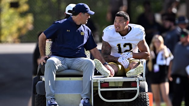 Notre Dame defensive lineman Jordan Botelho is carted off against Purdue in 202