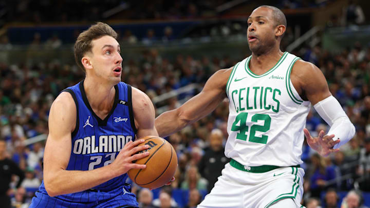 Apr 27, 2025; Orlando, Florida, USA; Orlando Magic forward Franz Wagner (22) drives to the basket past Boston Celtics center Al Horford (42) in the first quarter during game four of first round for the 2025 NBA Playoffs at Kia Center. Mandatory Credit: Nathan Ray Seebeck-Imagn Images