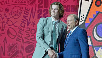 Jul 7, 2022; Montreal, Quebec, CANADA; Conor Geekie shakes hands with NHL commissioner Gary Bettman after being selected as the number eleven overall pick to the Arizona Coyotes in the first round of the 2022 NHL Draft at Bell Centre. Mandatory Credit: Eric Bolte-Imagn Images