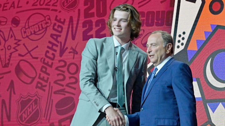 Jul 7, 2022; Montreal, Quebec, CANADA; Conor Geekie shakes hands with NHL commissioner Gary Bettman after being selected as the number eleven overall pick to the Arizona Coyotes in the first round of the 2022 NHL Draft at Bell Centre. Mandatory Credit: Eric Bolte-Imagn Images