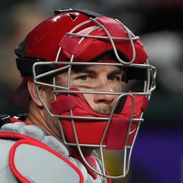 Aug 9, 2024; Phoenix, Arizona, USA; Philadelphia Phillies catcher J.T. Realmuto (10) looks for a sign against the Arizona Diamondbacks in the first inning at Chase Field