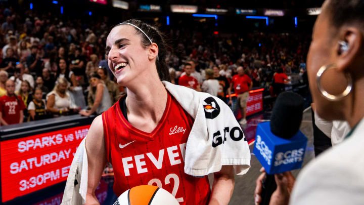 Indiana Fever guard Caitlin Clark (22) smiles in an interview.