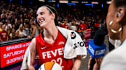 Indiana Fever guard Caitlin Clark smiles in an interview after becoming the first rookie to have a triple-double.