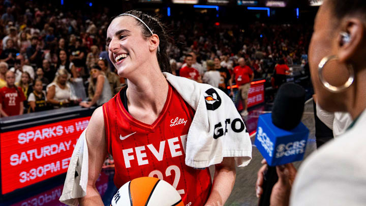 Indiana Fever guard Caitlin Clark (22) smiles in an interview