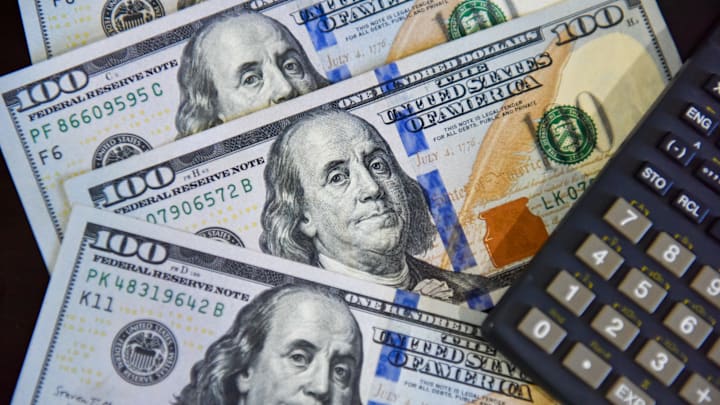 In this photo illustration, some 100 US dollar bills are...