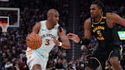 San Antonio Spurs guard Chris Paul dribbles against Golden State Warriors forward Kevon Looney in the fourth quarter at Chase Center. 