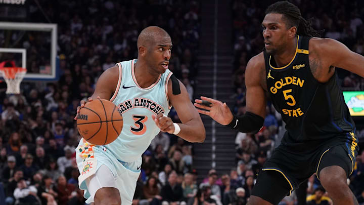 San Antonio Spurs guard Chris Paul dribbles against Golden State Warriors forward Kevon Looney in the fourth quarter at Chase Center. San Antonio Spurs guard Chris Paul dribbles against Golden State Warriors forward Kevon Looney in the fourth quarter at Chase Center.