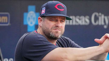 Jul 26, 2025; Kansas City, Missouri, USA; Cleveland Guardians manager Stephen Vogt (12) watches warm ups against the Kansas City Royals prior to a game at Kauffman Stadium. Mandatory Credit: Denny Medley-Imagn Images