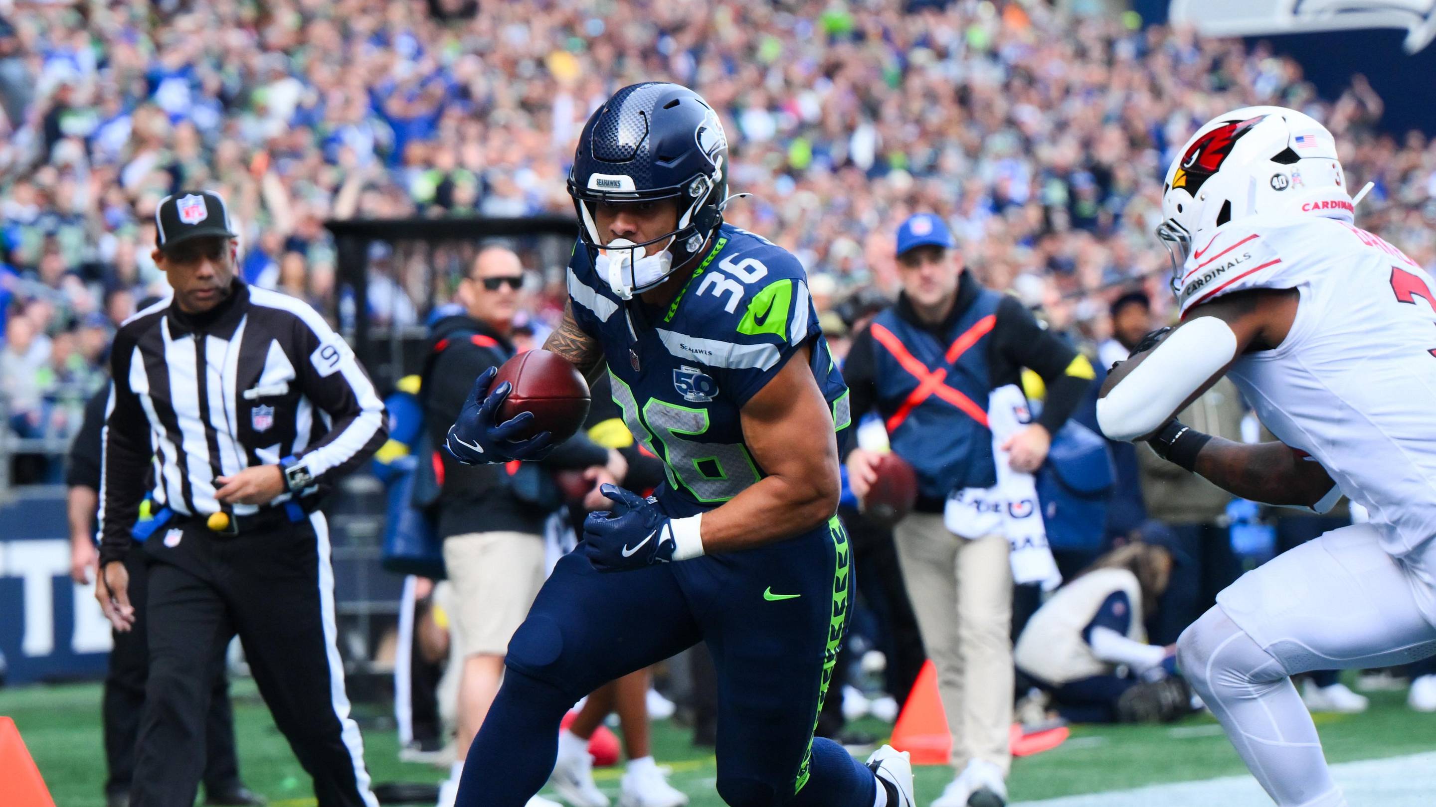 Nov 9, 2025; Seattle, Washington, USA; Seattle Seahawks running back George Holani (36) rushes for a touchdown as Arizona Cardinals safety Budda Baker (3) defends during the first quarter at Lumen Field. Mandatory Credit: Steven Bisig-Imagn Images