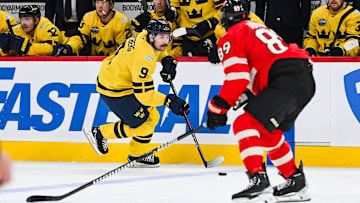 Feb 12, 2025; Montreal, Quebec, CAN; [Imagn Images direct customers only] Team Sweden forward Filip Forsberg (9) plays the puck against Team Canada defenseman Drew Doughty (89) in the second period during a 4 Nations Face-Off ice hockey game at Bell Centre. Mandatory Credit: David Kirouac-Imagn Images