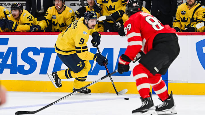 Feb 12, 2025; Montreal, Quebec, CAN; [Imagn Images direct customers only] Team Sweden forward Filip Forsberg (9) plays the puck against Team Canada defenseman Drew Doughty (89) in the second period during a 4 Nations Face-Off ice hockey game at Bell Centre. Mandatory Credit: David Kirouac-Imagn Images