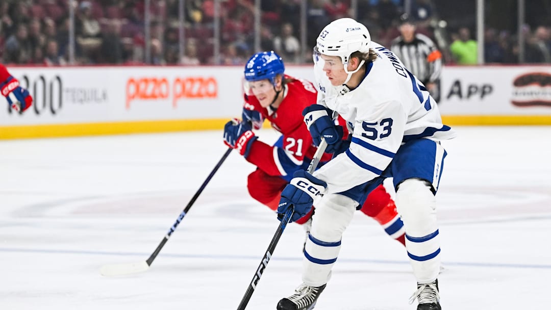 Sep 30, 2023; Montreal, Quebec, CAN; Toronto Maple Leafs right wing Easton Cowan (53) plays the puck against the Montreal Canadiens during the first period at Bell Centre. Mandatory Credit: David Kirouac-Imagn Images