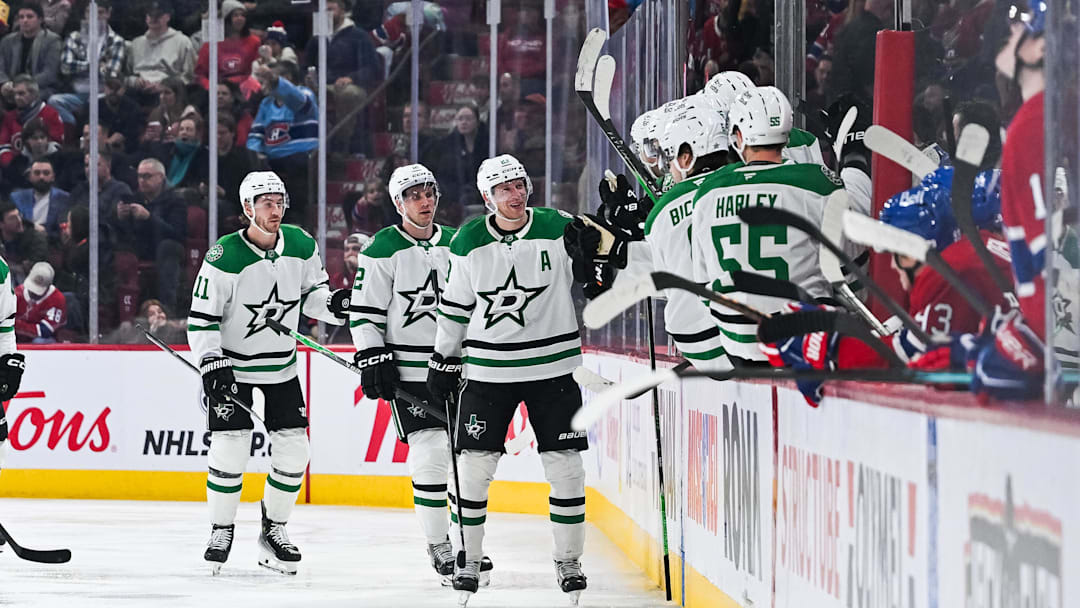 Nov 13, 2025; Montreal, Quebec, CAN; Dallas Stars defenseman Esa Lindell (23) celebrates with his teammates at the bench his goal against the Montreal Canadiens during the second period at Bell Centre. Mandatory Credit: David Kirouac-Imagn Images
