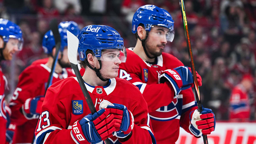Apr 26, 2026; Montreal, Quebec, CAN; Montreal Canadiens right wing Cole Caufield (13) looks on beside center Nick Suzuki (14) against the Tampa Bay Lightning during the second period in game four of the first round of the 2026 Stanley Cup Playoffs at Bell Centre. Mandatory Credit: David Kirouac-Imagn Images