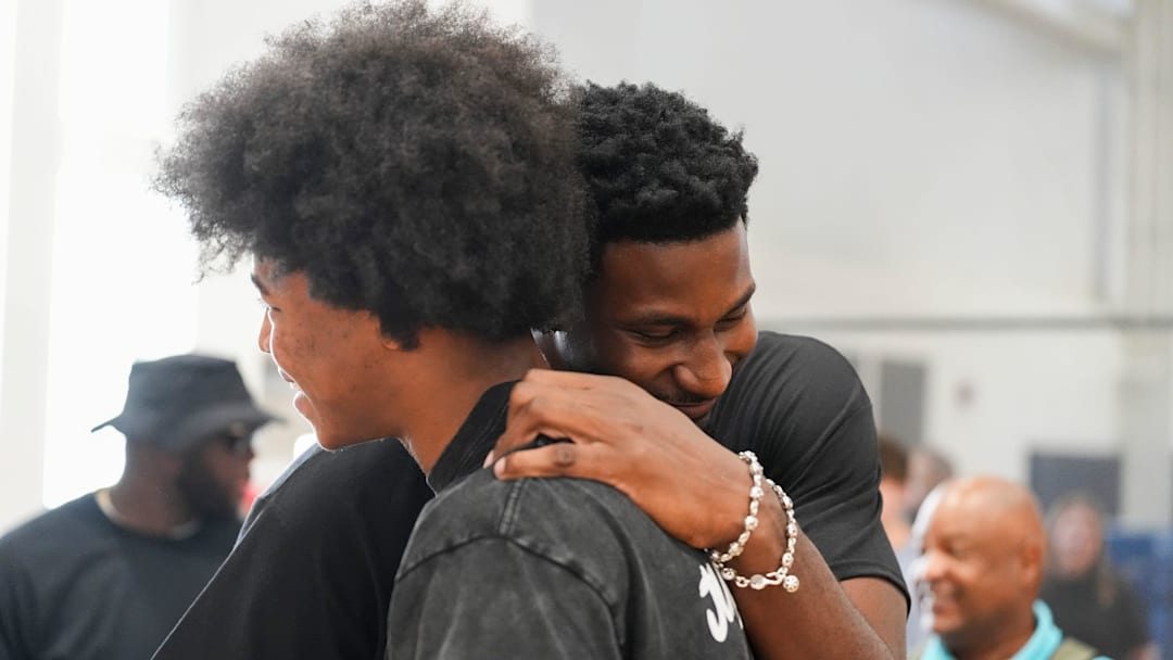 Grizzlies players Jaylen Wells and Jaren Jackson Jr. hug during the Jaren Jackson Jr. Youth Basketball Camp at the Memphis Sports & Events Center on September 13, 2025.